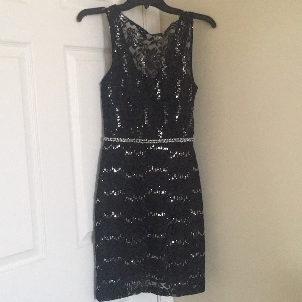 Black mini dress with sequins.